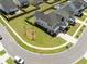 Aerial view of a charming house surrounded by a lush green yard and a neighborhood at 158 Woodland Oak Way, Summerville, SC 29485