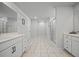 Spacious bathroom featuring sleek white vanities, shower stall, and stylish marble flooring at 158 Woodland Oak Way, Summerville, SC 29485