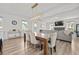 Dining area featuring hardwood floors and an elegant chandelier with a view of the fireplace at 158 Woodland Oak Way, Summerville, SC 29485