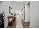 Stylish entryway with wood floors, console table, mirror, and decorative lighting at 158 Woodland Oak Way, Summerville, SC 29485