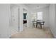 Bright hallway with an open doorway leading to a bedroom and an adjacent office space at 158 Woodland Oak Way, Summerville, SC 29485