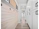 Hallway featuring custom storage, coat hooks, and seamlessly blends function with style at 158 Woodland Oak Way, Summerville, SC 29485