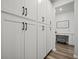 Hallway with storage cabinets leads to a charming office space with a desk at 158 Woodland Oak Way, Summerville, SC 29485