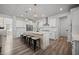 Large kitchen with white cabinets, a stainless steel refrigerator, and modern appliances at 158 Woodland Oak Way, Summerville, SC 29485