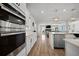 Open-concept kitchen with stainless steel appliances and a view to the living room at 158 Woodland Oak Way, Summerville, SC 29485