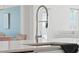 Modern kitchen sink with a stainless steel faucet and white countertops at 158 Woodland Oak Way, Summerville, SC 29485