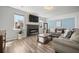 Cozy living room features a fireplace, television, and comfortable seating area at 158 Woodland Oak Way, Summerville, SC 29485