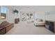 Spacious living room with neutral decor, large windows, and comfortable furniture at 158 Woodland Oak Way, Summerville, SC 29485