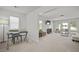 Open-concept living area with large windows and a comfortable seating arrangement at 158 Woodland Oak Way, Summerville, SC 29485