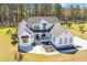 Stylish two-story farmhouse featuring black trim and a spacious front yard and green lawn at 161 Ryefield Ln, Ridgeville, SC 29472