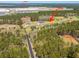 Aerial view of property, highlighting home and surrounding facilities plus distant business areas at 161 Ryefield Ln, Ridgeville, SC 29472