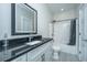 Modern bathroom with a dark granite countertop, white cabinets, and a shower-tub combination at 161 Ryefield Ln, Ridgeville, SC 29472