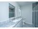Well-appointed bathroom with marble vanity top and stylish gray-tiled walk-in shower at 161 Ryefield Ln, Ridgeville, SC 29472