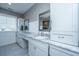 Bright bathroom boasts double sinks, marble countertops, and a framed mirror at 161 Ryefield Ln, Ridgeville, SC 29472