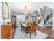 Elegant dining room featuring a chandelier, hardwood floors, and beautiful natural light at 161 Ryefield Ln, Ridgeville, SC 29472