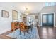 Elegant dining room with hardwood floors, a chandelier, and a classic wooden table at 161 Ryefield Ln, Ridgeville, SC 29472
