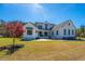 Lovely two-story home featuring manicured landscaping and a welcoming front porch, set on a lush lawn at 161 Ryefield Ln, Ridgeville, SC 29472