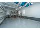 Spacious garage with epoxy floor, ample storage, and overhead kayak storage system at 161 Ryefield Ln, Ridgeville, SC 29472