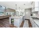 Spacious open kitchen with an island, stainless steel appliances, and marble countertops at 161 Ryefield Ln, Ridgeville, SC 29472