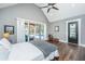 Comfortable main bedroom with a vaulted ceiling and access to an outdoor living space at 161 Ryefield Ln, Ridgeville, SC 29472