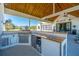 Outdoor kitchen with a built-in grill, sink, beverage cooler, and plenty of counter space at 161 Ryefield Ln, Ridgeville, SC 29472