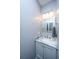 Elegant powder room with marble countertop vanity, adding a touch of luxury to the home at 161 Ryefield Ln, Ridgeville, SC 29472