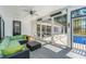 Relaxing screened porch with comfortable seating and views of the pool and backyard at 161 Ryefield Ln, Ridgeville, SC 29472