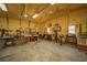 Spacious and well-lit metal outbuilding with organized tools, workbenches, and ample workspace at 161 Ryefield Ln, Ridgeville, SC 29472