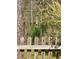 Backyard scene with a bird enjoying the bird feeder at 1659 Seabago Dr, Charleston, SC 29414