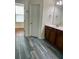 Bathroom features wood-look tile flooring, modern vanity, and a view into an adjacent room at 1659 Seabago Dr, Charleston, SC 29414