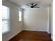 Bright bedroom featuring hardwood floors, two windows, and neutral paint at 1659 Seabago Dr, Charleston, SC 29414