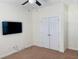 Bedroom featuring ceiling fan, wall-mounted TV, double closet and carpeting at 1659 Seabago Dr, Charleston, SC 29414