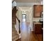 Inviting entryway with hardwood floors, staircase and view to the front door at 1659 Seabago Dr, Charleston, SC 29414