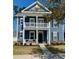 Charming two-story home with a welcoming front porch and blue siding at 1659 Seabago Dr, Charleston, SC 29414