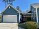 Attached two-car garage with a white door, offering convenience and ample parking at 1659 Seabago Dr, Charleston, SC 29414