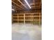 Spacious garage with wood framing, shelving and painted concrete flooring at 1659 Seabago Dr, Charleston, SC 29414