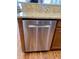 Stainless steel dishwasher with matching cabinets and granite countertops in the kitchen at 1659 Seabago Dr, Charleston, SC 29414