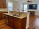 Kitchen island with granite countertops, stainless steel dishwasher, and open to the living room at 1659 Seabago Dr, Charleston, SC 29414