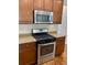 Modern kitchen with stainless steel gas range, microwave, and beautiful granite countertops at 1659 Seabago Dr, Charleston, SC 29414