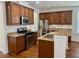 Well-equipped kitchen with wood cabinets, granite counters, stainless steel appliances, and ample counter space at 1659 Seabago Dr, Charleston, SC 29414