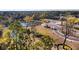 An aerial view of a community pond and future home lots, set amid trees and lush nature at 1683 Cultivation Ln # 460, Mount Pleasant, SC 29466