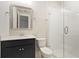 Bathroom featuring modern vanity with framed mirror and glass enclosed shower with white tiling at 1683 Cultivation Ln # 460, Mount Pleasant, SC 29466
