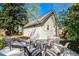 Backyard patio features seating area, chairs and table surrounded by lush landscaping at 1706 W Avalon Cir, Charleston, SC 29407