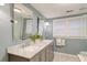 Modern bathroom featuring a double vanity, a walk-in shower and tiled floors at 1706 W Avalon Cir, Charleston, SC 29407