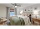 Cozy bedroom featuring a decorative ceiling fan, window with blinds and stylish wall art at 1706 W Avalon Cir, Charleston, SC 29407