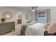 Well-lit bedroom featuring neutral decor, dresser and ceiling fan and decorative mirror at 1706 W Avalon Cir, Charleston, SC 29407