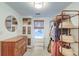 Organized closet with custom shelving, dresser, and lots of storage space at 1706 W Avalon Cir, Charleston, SC 29407