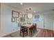 Cozy dining room features a wooden table, unique light fixture and gallery wall at 1706 W Avalon Cir, Charleston, SC 29407
