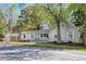 Charming cottage-style home with inviting front porch and well-maintained landscaping at 1706 W Avalon Cir, Charleston, SC 29407