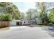 Charming home with a carport and long driveway featuring a well-maintained front yard at 1706 W Avalon Cir, Charleston, SC 29407